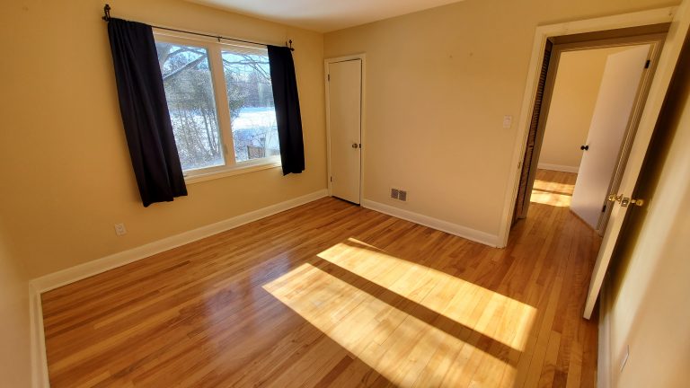 Bedroom 2 (11`x 11'3") - windows facing back yard
